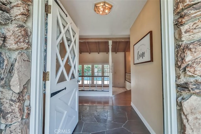 17654 Prairie St, Northridge, CA 91325 - foyer featuring baseboards and dark stone finish flooring