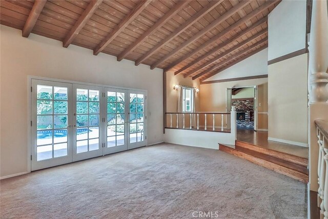 17654 Prairie St, Northridge, CA 91325 - unfurnished living room featuring a wooden ceiling with exposed beams, carpet floors, plenty of natural light, french doors, and high vaulted ceiling
