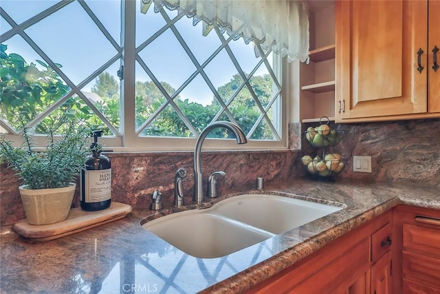 17654 Prairie St, Northridge, CA 91325 - kitchen featuring backsplash, plenty of natural light, open shelves, and dark stone countertops