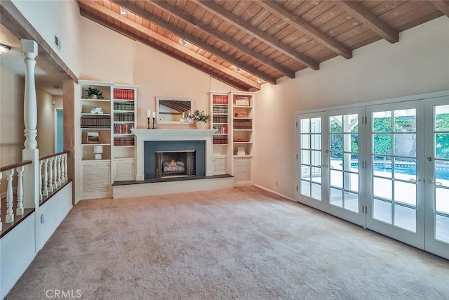 17654 Prairie St, Northridge, CA 91325 - unfurnished living room with a wooden ceiling with exposed beams, carpet flooring, high vaulted ceiling, a fireplace with raised hearth, and french doors