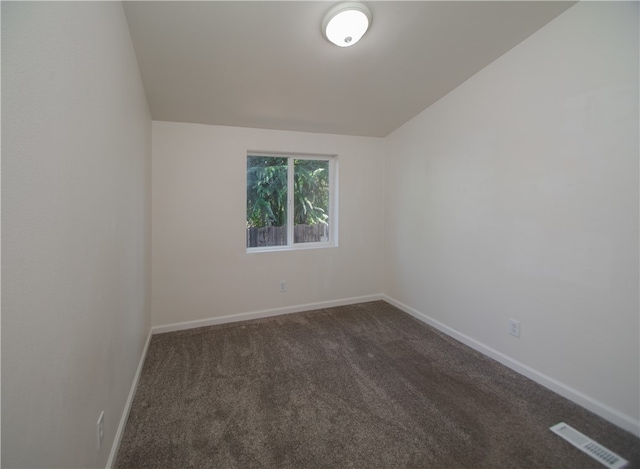 3556 Cypress St, Clearlake, CA 95422 - unfurnished room with dark colored carpet and vaulted ceiling