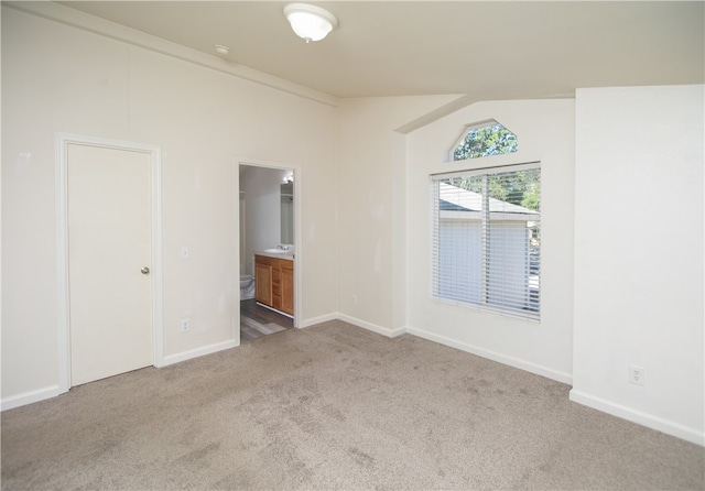 3556 Cypress St, Clearlake, CA 95422 - unfurnished bedroom featuring carpet flooring, lofted ceiling, and ensuite bathroom
