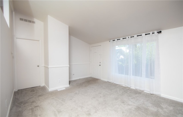 3556 Cypress St, Clearlake, CA 95422 - carpeted empty room with vaulted ceiling and baseboards