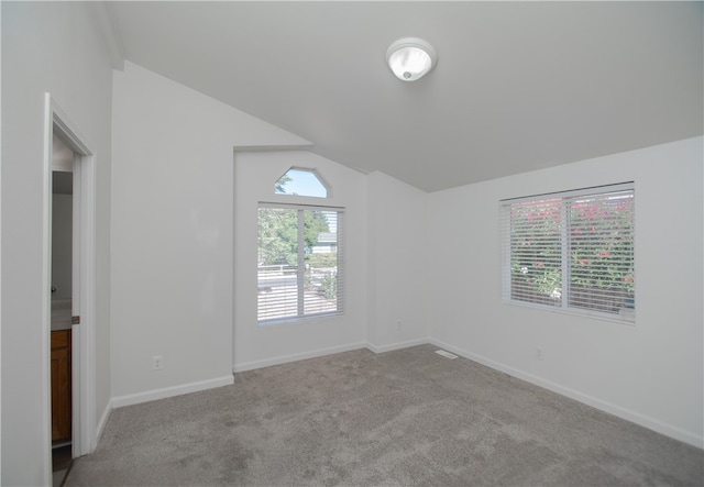 3556 Cypress St, Clearlake, CA 95422 - carpeted empty room with vaulted ceiling