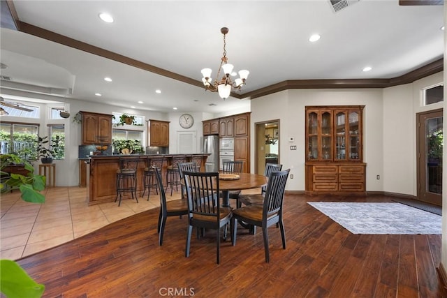 1806 Briercliff Ct, Bakersfield, CA 93311 - dining space with a chandelier, wood finished floors, and recessed lighting