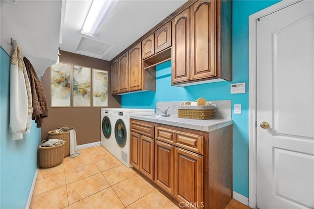 1806 Briercliff Ct, Bakersfield, CA 93311 - laundry area featuring cabinet space, separate washer and dryer, and light tile patterned floors