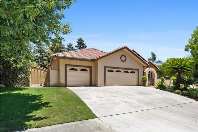 1806 Briercliff Ct, Bakersfield, CA 93311 - mediterranean / spanish-style home featuring a garage, stucco siding, concrete driveway, a front lawn, and a tiled roof