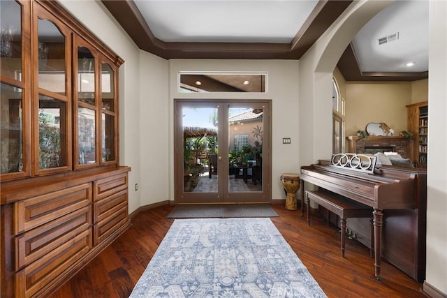 1806 Briercliff Ct, Bakersfield, CA 93311 - foyer entrance with arched walkways, dark wood finished floors, a raised ceiling, recessed lighting, and french doors