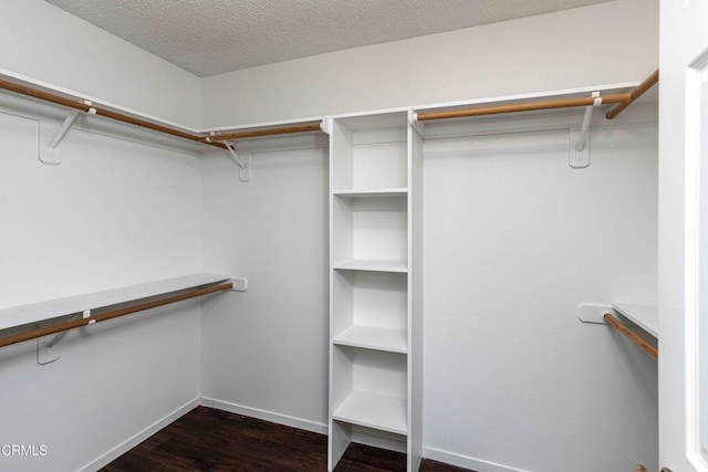 4120 Abbott Dr, Bakersfield, CA 93312 - walk in closet featuring dark wood finished floors