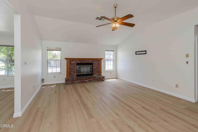 4120 Abbott Dr, Bakersfield, CA 93312 - unfurnished living room featuring light wood-type flooring, ceiling fan, plenty of natural light, a fireplace, and high vaulted ceiling