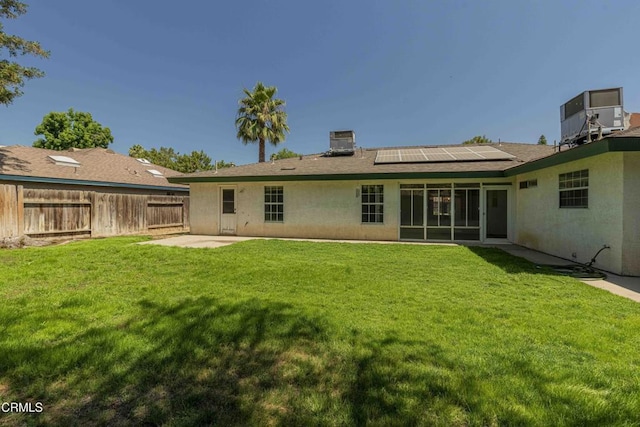 4120 Abbott Dr, Bakersfield, CA 93312 - rear view of house featuring solar panels, stucco siding, a patio area, and a shingled roof