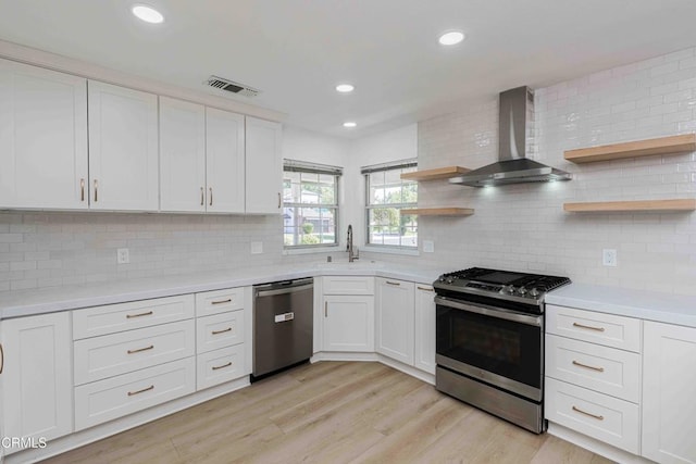 4120 Abbott Dr, Bakersfield, CA 93312 - kitchen with appliances with stainless steel finishes, wall chimney exhaust hood, open shelves, light countertops, and recessed lighting