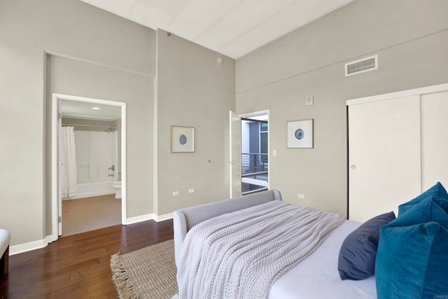 425 W Beech St Unit 417, San Diego, CA 92101 - bedroom with wood finished floors, a high ceiling, a closet, and ensuite bath