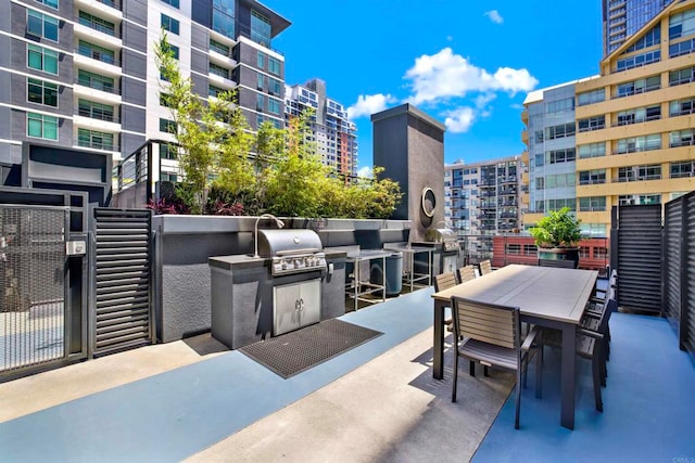 425 W Beech St Unit 417, San Diego, CA 92101 - view of patio with outdoor dining area, a view of city, and area for grilling