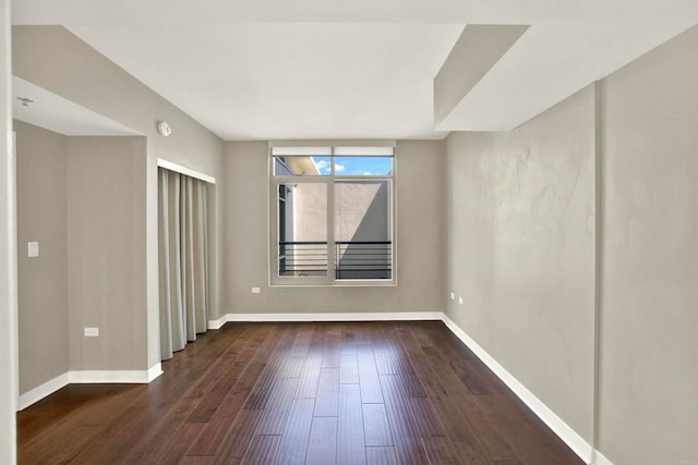 425 W Beech St Unit 417, San Diego, CA 92101 - spare room featuring baseboards and hardwood / wood-style flooring