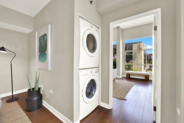 425 W Beech St Unit 417, San Diego, CA 92101 - laundry room featuring stacked washing machine and dryer and dark wood-style flooring