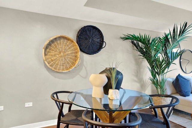 425 W Beech St Unit 417, San Diego, CA 92101 - dining space featuring baseboards and wood finished floors