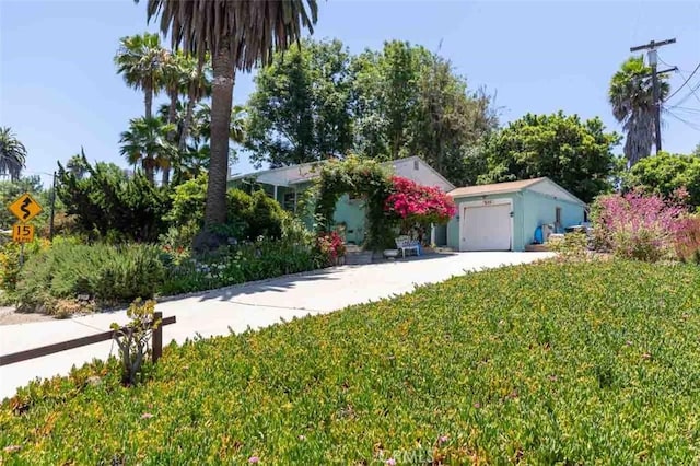 869 Phillips St, Vista, CA 92083 - obstructed view of property with a front yard and a garage