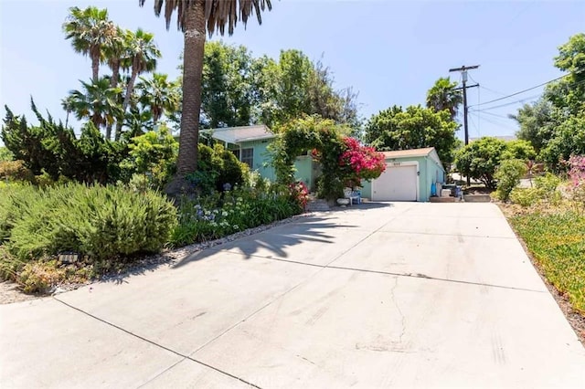 869 Phillips St, Vista, CA 92083 - view of front facade with concrete driveway and a garage
