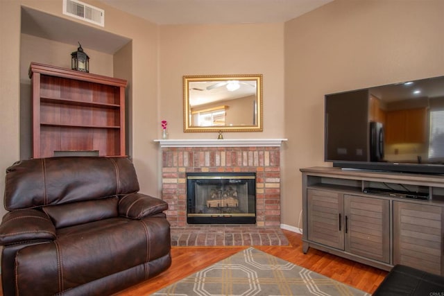 2414 Falcon Valley Dr, Chula Vista, CA 91914 - living room with wood finished floors and a brick fireplace