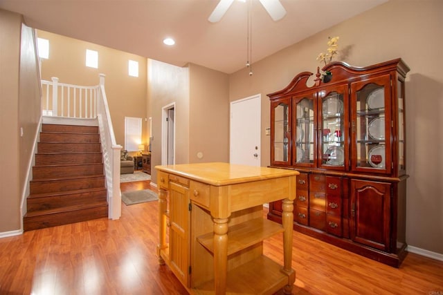 2414 Falcon Valley Dr, Chula Vista, CA 91914 - kitchen featuring light wood-style flooring, ceiling fan, recessed lighting, light countertops, and a kitchen island