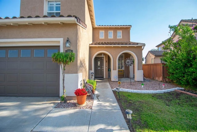 2414 Falcon Valley Dr, Chula Vista, CA 91914 - mediterranean / spanish house with stucco siding, a tile roof, covered porch, and driveway