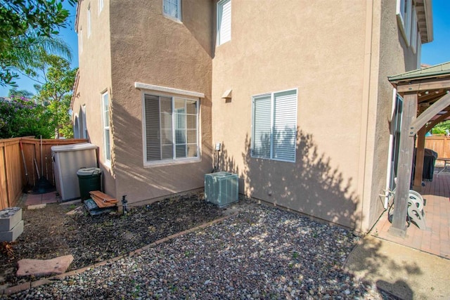 2414 Falcon Valley Dr, Chula Vista, CA 91914 - rear view of property with stucco siding, a fenced backyard, and a patio