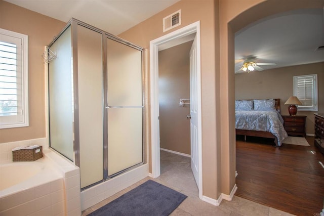 2414 Falcon Valley Dr, Chula Vista, CA 91914 - ensuite bathroom featuring a shower stall, a bath, a ceiling fan, and tile patterned flooring