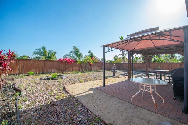 2414 Falcon Valley Dr, Chula Vista, CA 91914 - fenced backyard with a gazebo and outdoor dining area