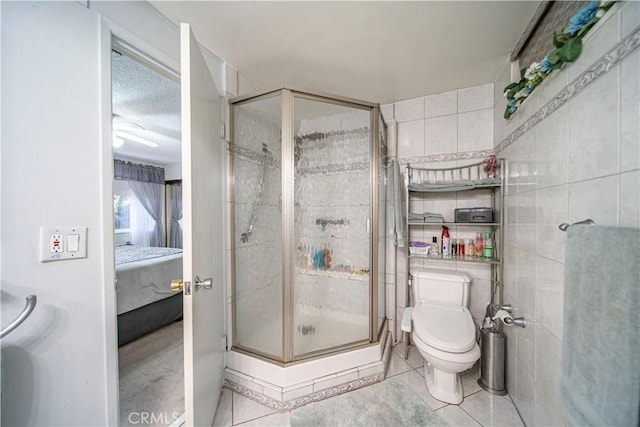 3032 Pietro Dr, Hacienda Heights, CA 91745 - ensuite bathroom with tile patterned floors, a stall shower, and tile walls