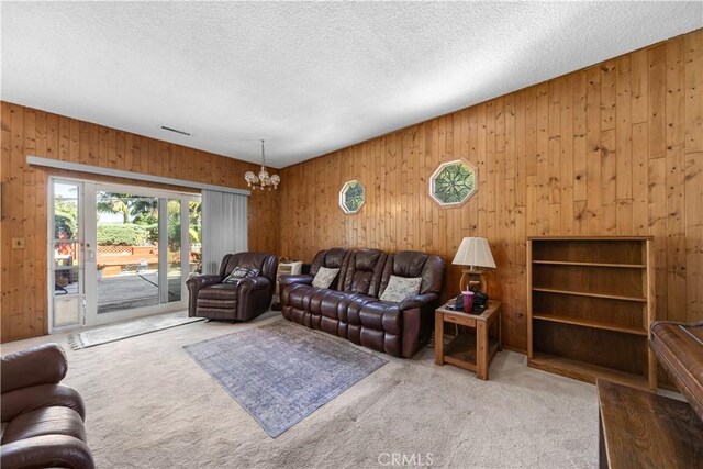 3032 Pietro Dr, Hacienda Heights, CA 91745 - carpeted living room with a chandelier, wooden walls, and a textured ceiling