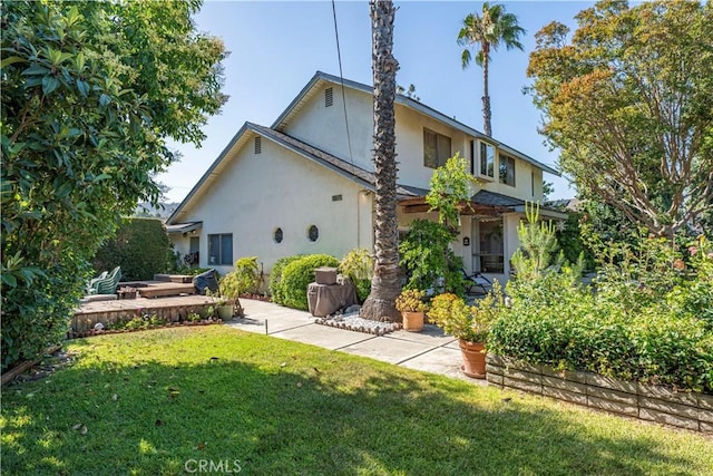 3032 Pietro Dr, Hacienda Heights, CA 91745 - rear view of house featuring stucco siding, a lawn, and a patio area
