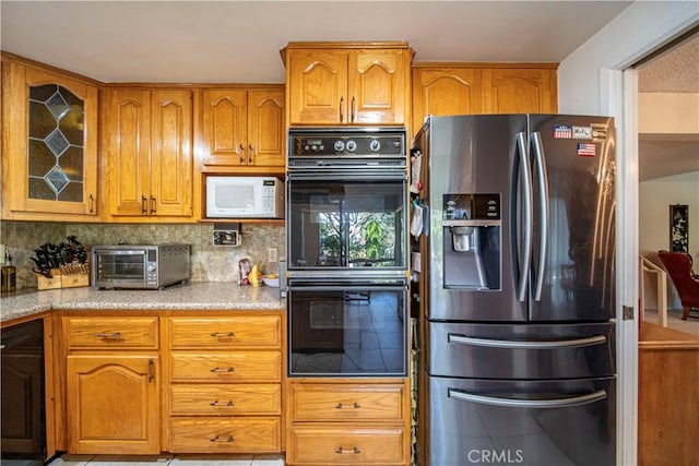 3032 Pietro Dr, Hacienda Heights, CA 91745 - kitchen with stainless steel fridge, white microwave, brown cabinets, decorative backsplash, and glass insert cabinets