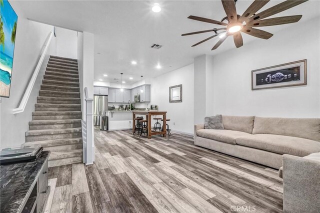17035 Independence Way, Yorba Linda, CA 92886 - living area with recessed lighting, wood finished floors, stairway, and a ceiling fan