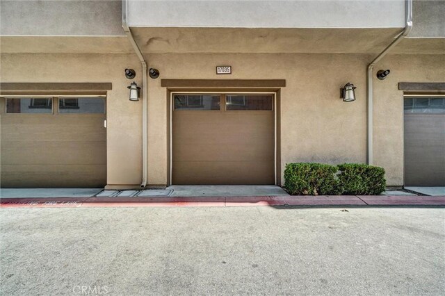 17035 Independence Way, Yorba Linda, CA 92886 - doorway to property with a garage and stucco siding