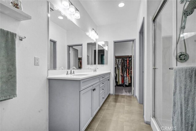 17035 Independence Way, Yorba Linda, CA 92886 - bathroom with double vanity, a shower stall, and a walk in closet