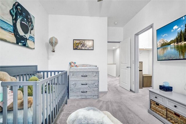 17035 Independence Way, Yorba Linda, CA 92886 - bedroom featuring light colored carpet, a crib, and a walk in closet