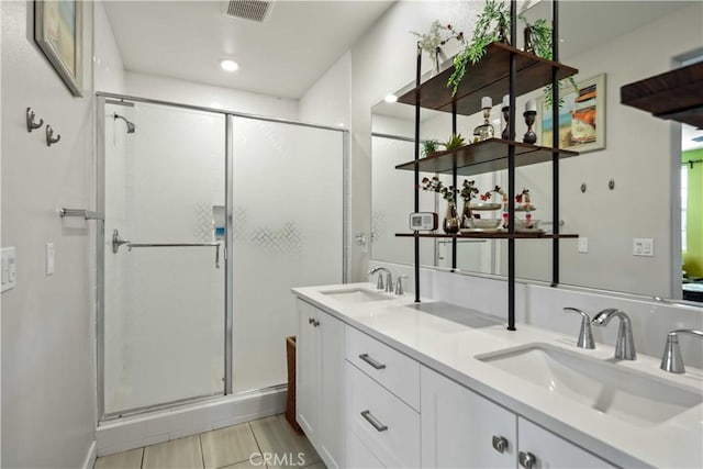 26957 Winding Trail Ct, Valencia, CA 91381 - bathroom with a shower stall, double vanity, tile patterned flooring, and recessed lighting