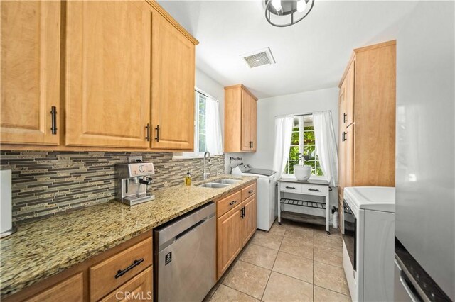 44055 Elm Ave, Lancaster, CA 93534 - kitchen featuring stainless steel dishwasher, backsplash, light stone countertops, and light tile patterned floors