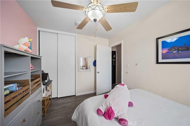 44055 Elm Ave, Lancaster, CA 93534 - bedroom featuring dark wood-style floors, a closet, and ceiling fan
