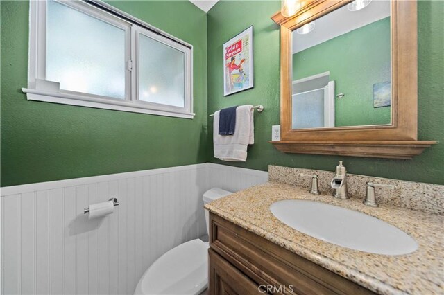 44055 Elm Ave, Lancaster, CA 93534 - bathroom featuring vanity and a wainscoted wall