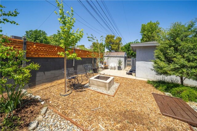 44055 Elm Ave, Lancaster, CA 93534 - view of yard featuring an outdoor fire pit