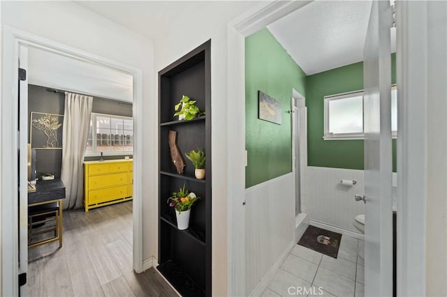 44055 Elm Ave, Lancaster, CA 93534 - full bathroom featuring healthy amount of natural light, a wainscoted wall, and a shower