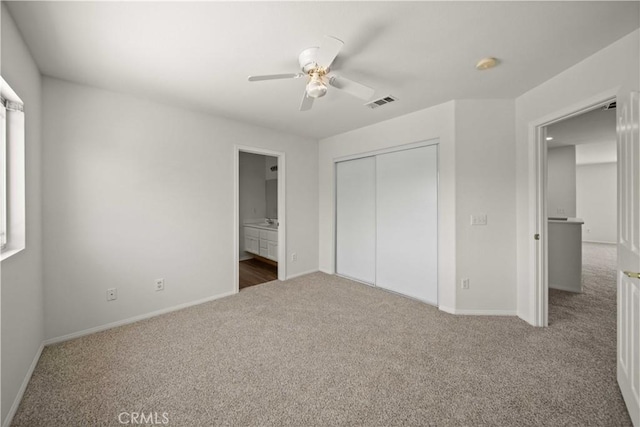 40225 Watford Way, Palmdale, CA 93551 - unfurnished bedroom featuring carpet flooring, a closet, a ceiling fan, and connected bathroom