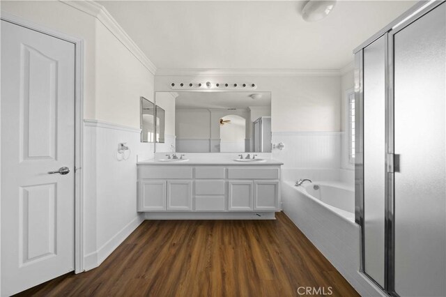 40225 Watford Way, Palmdale, CA 93551 - full bath featuring ornamental molding, wainscoting, double vanity, a bath, and wood finished floors