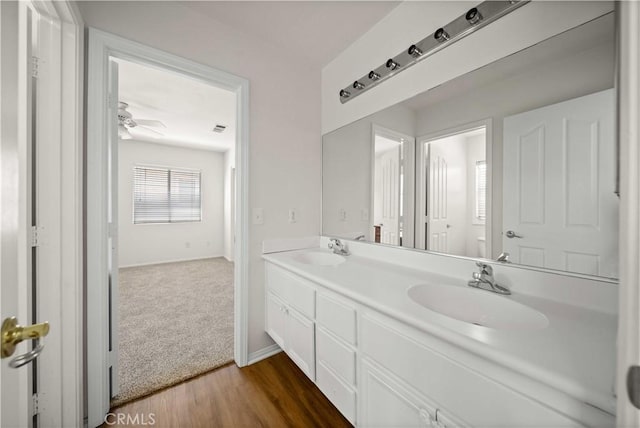 40225 Watford Way, Palmdale, CA 93551 - full bathroom featuring double vanity, wood finished floors, and ceiling fan