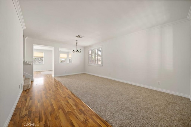 40225 Watford Way, Palmdale, CA 93551 - empty room featuring a chandelier, stairway, crown molding, and wood finished floors