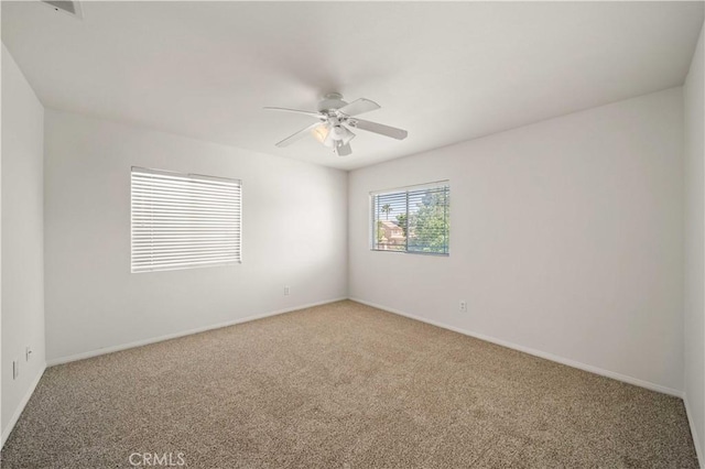 40225 Watford Way, Palmdale, CA 93551 - unfurnished room with light carpet and ceiling fan