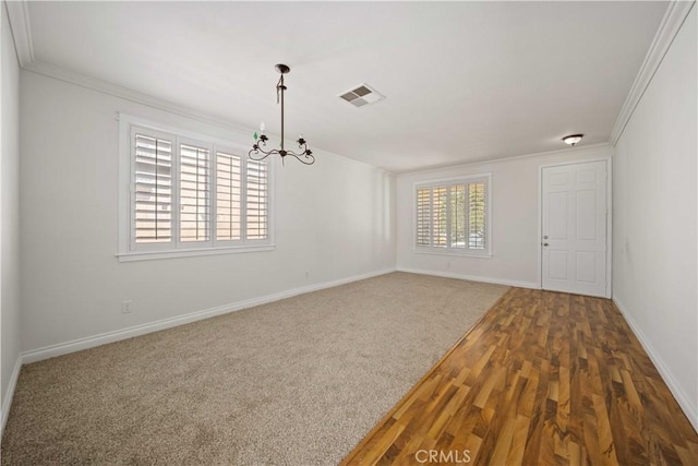 40225 Watford Way, Palmdale, CA 93551 - unfurnished room with crown molding, a chandelier, and wood finished floors
