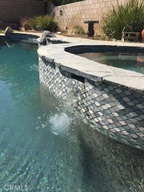 40225 Watford Way, Palmdale, CA 93551 - view of swimming pool featuring a pool with connected hot tub